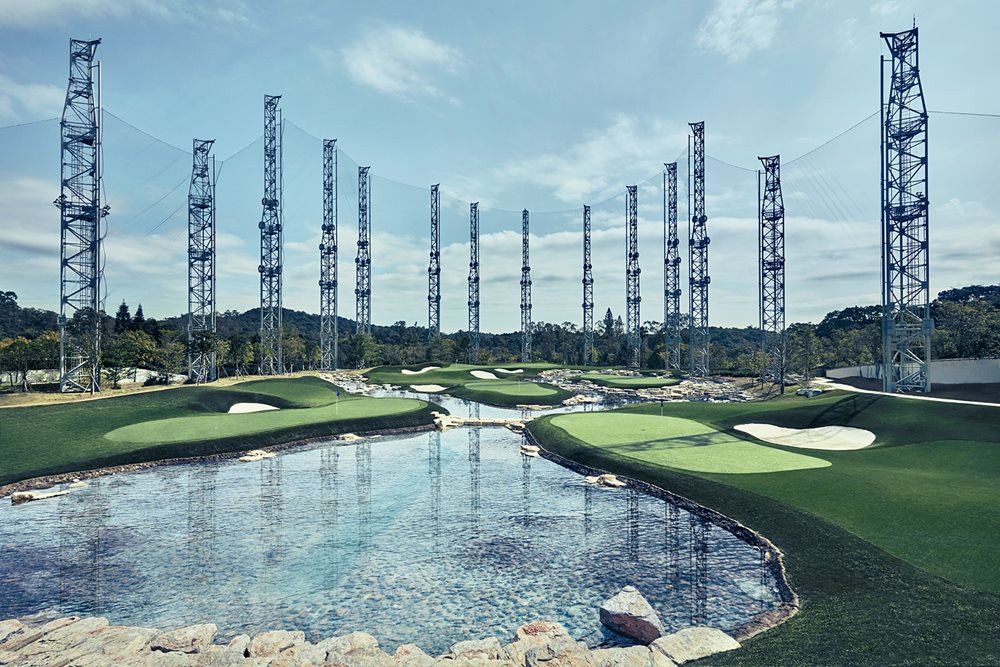Atlanta Synthetic grass golf course with water and tall metal towers