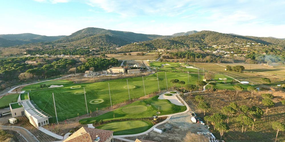 Atlanta Aerial view of a synthetic grass golf course surrounded by hills