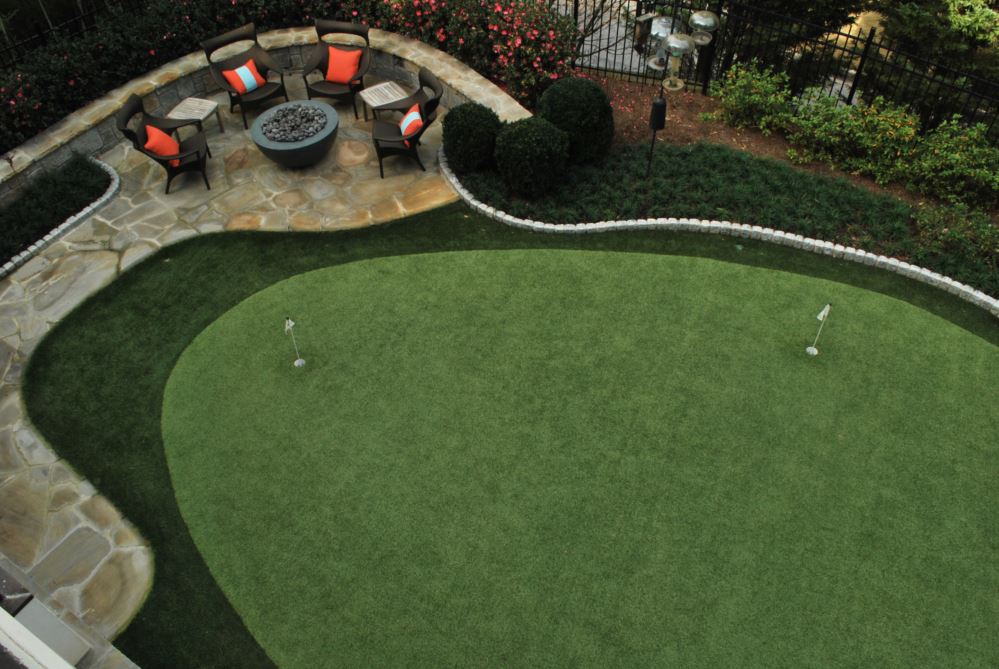 overhead shot of a putting green with flags